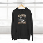 Black Country As Fuck hoodie on a wooden hanger by a window
