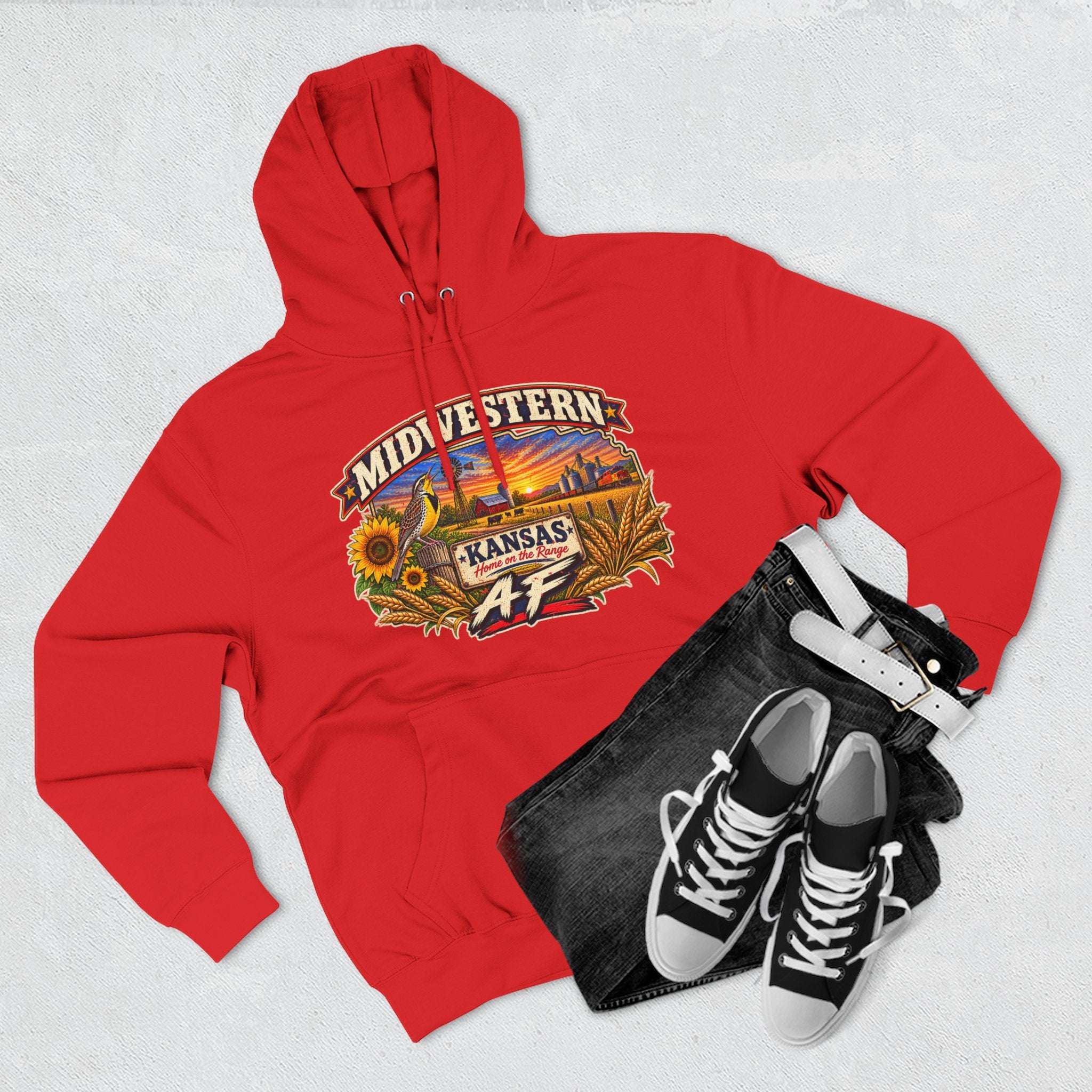 Red Kansas AF hoodie flat-lay with black jeans and high-top sneakers