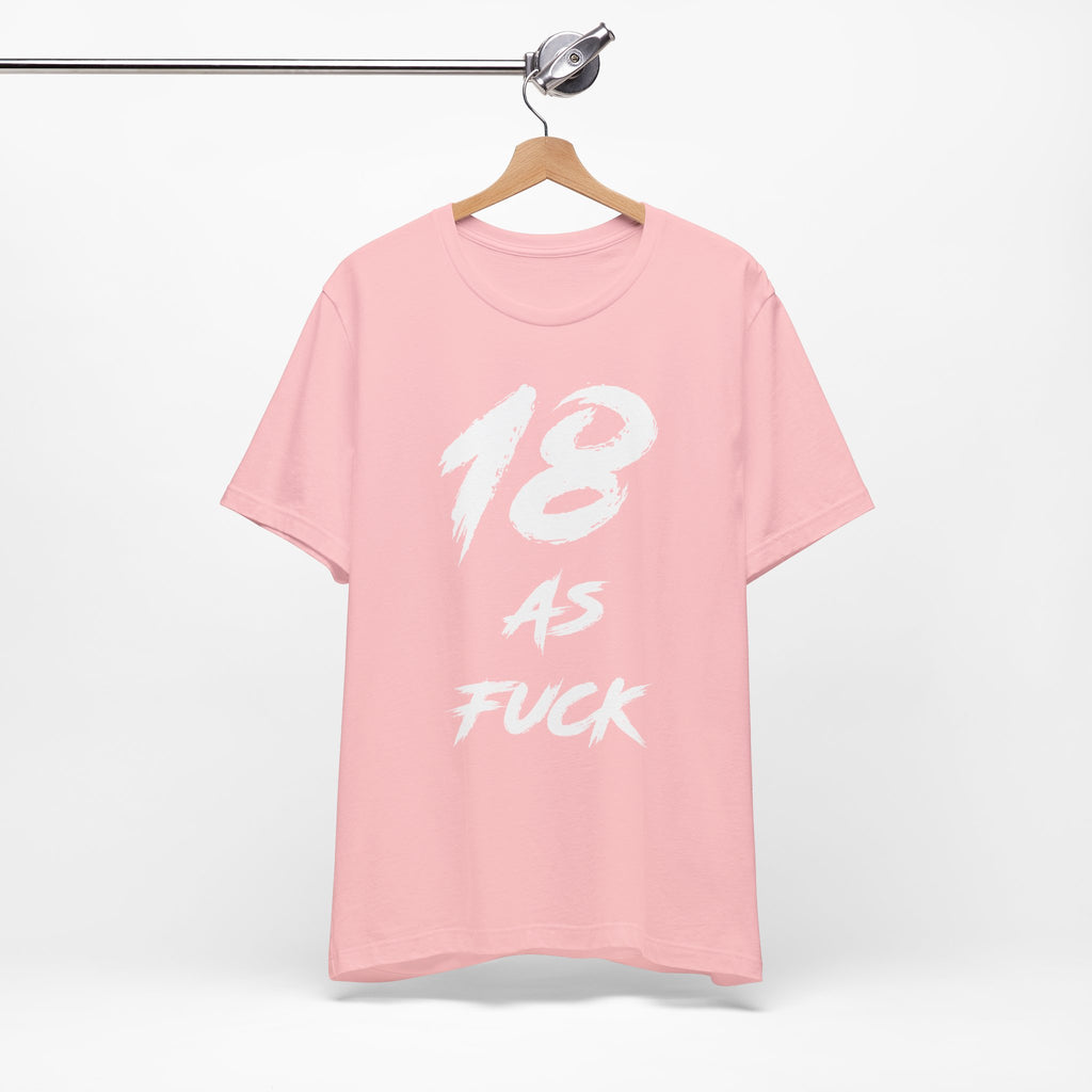 Pink birthday t-shirt on a hanger with the white 18 AS FUCK brush print