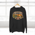 Black Nebraska hoodie on a wooden hanger, front print lit by window light