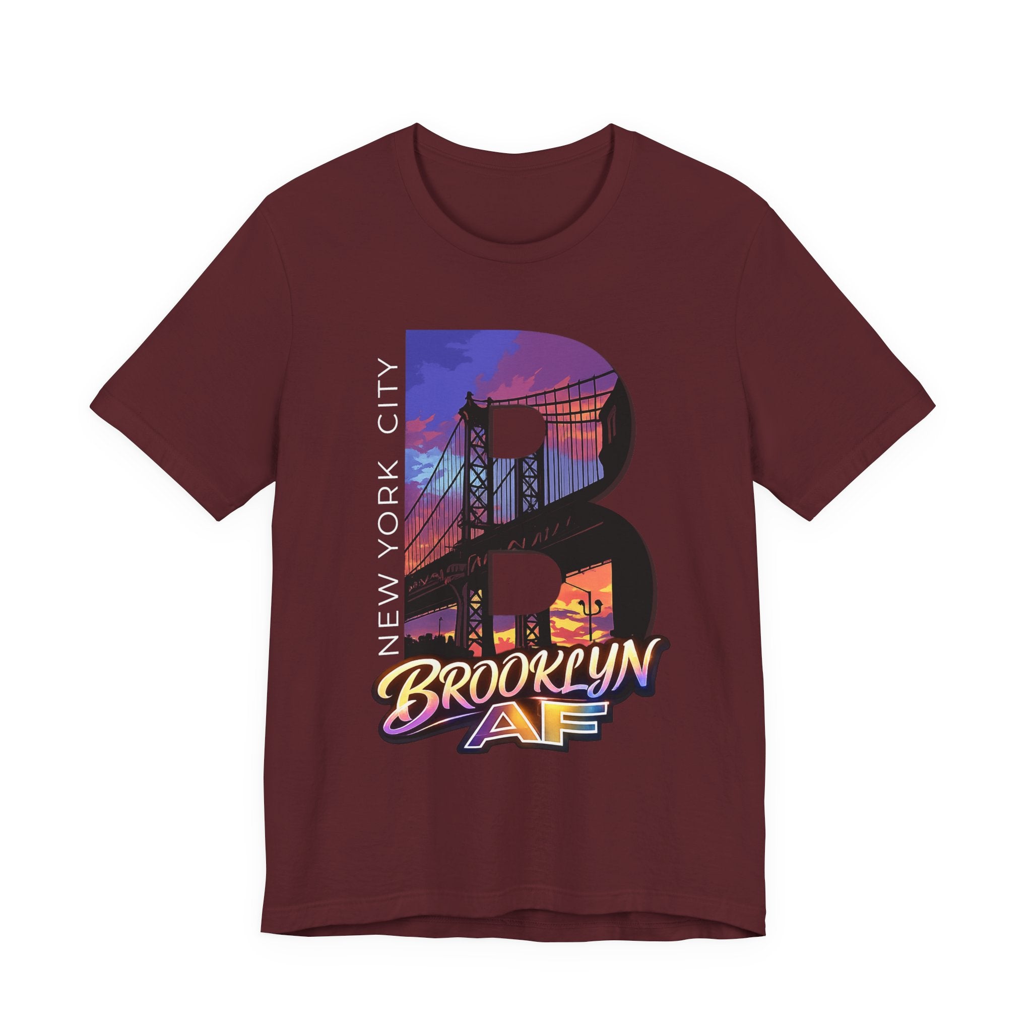 Maroon t-shirt, flat lay front view, with a bold B and a purple-orange Brooklyn Bridge sunset skyline graphic.