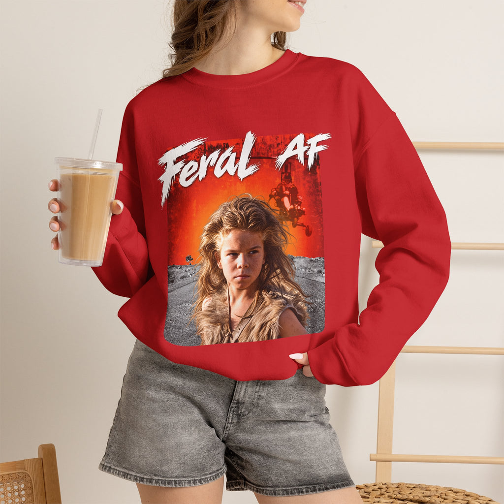Woman wearing the Red Feral AF crewneck with denim shorts, holding an iced coffee