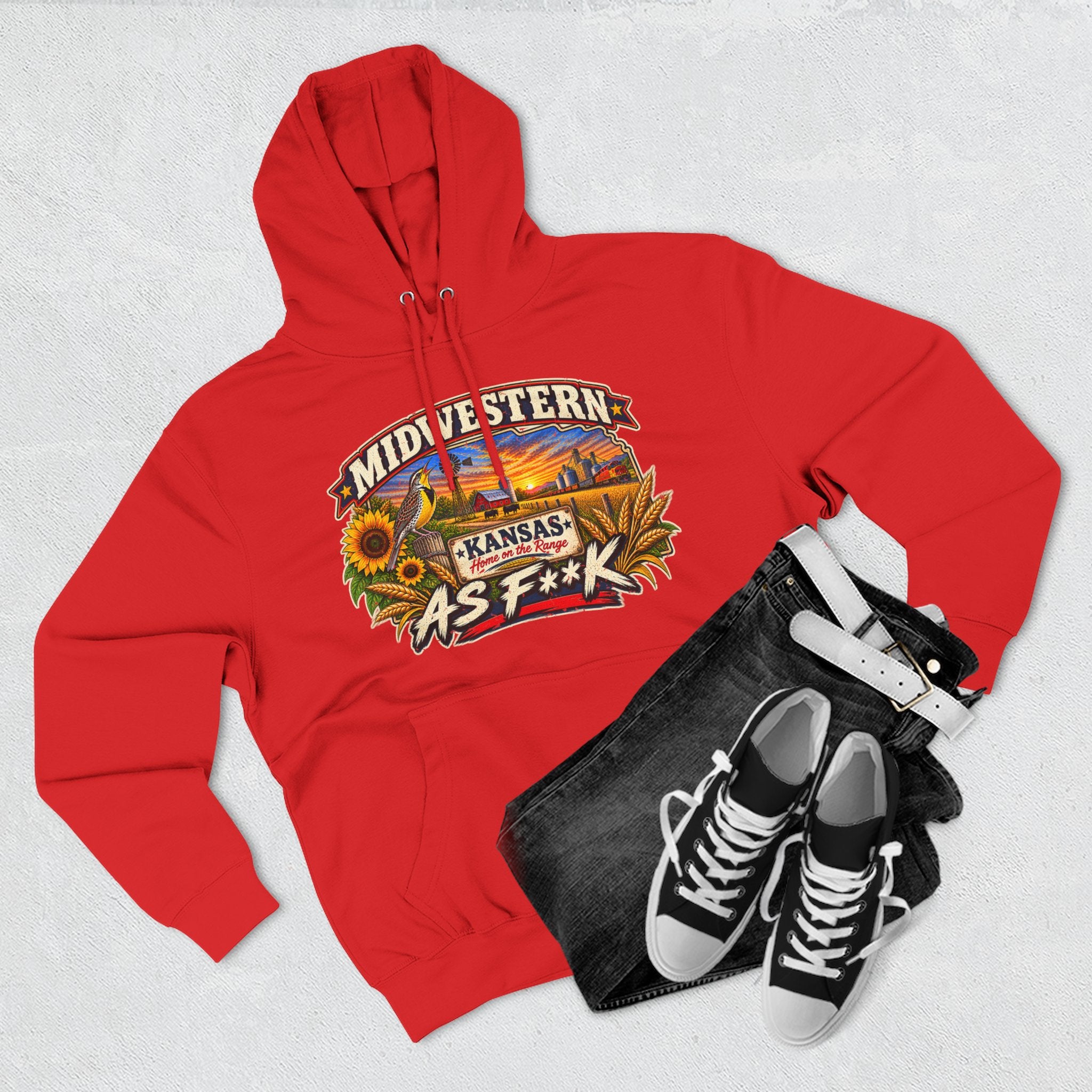 Red Kansas As F**K hoodie flat-lay styled with dark jeans and sneakers