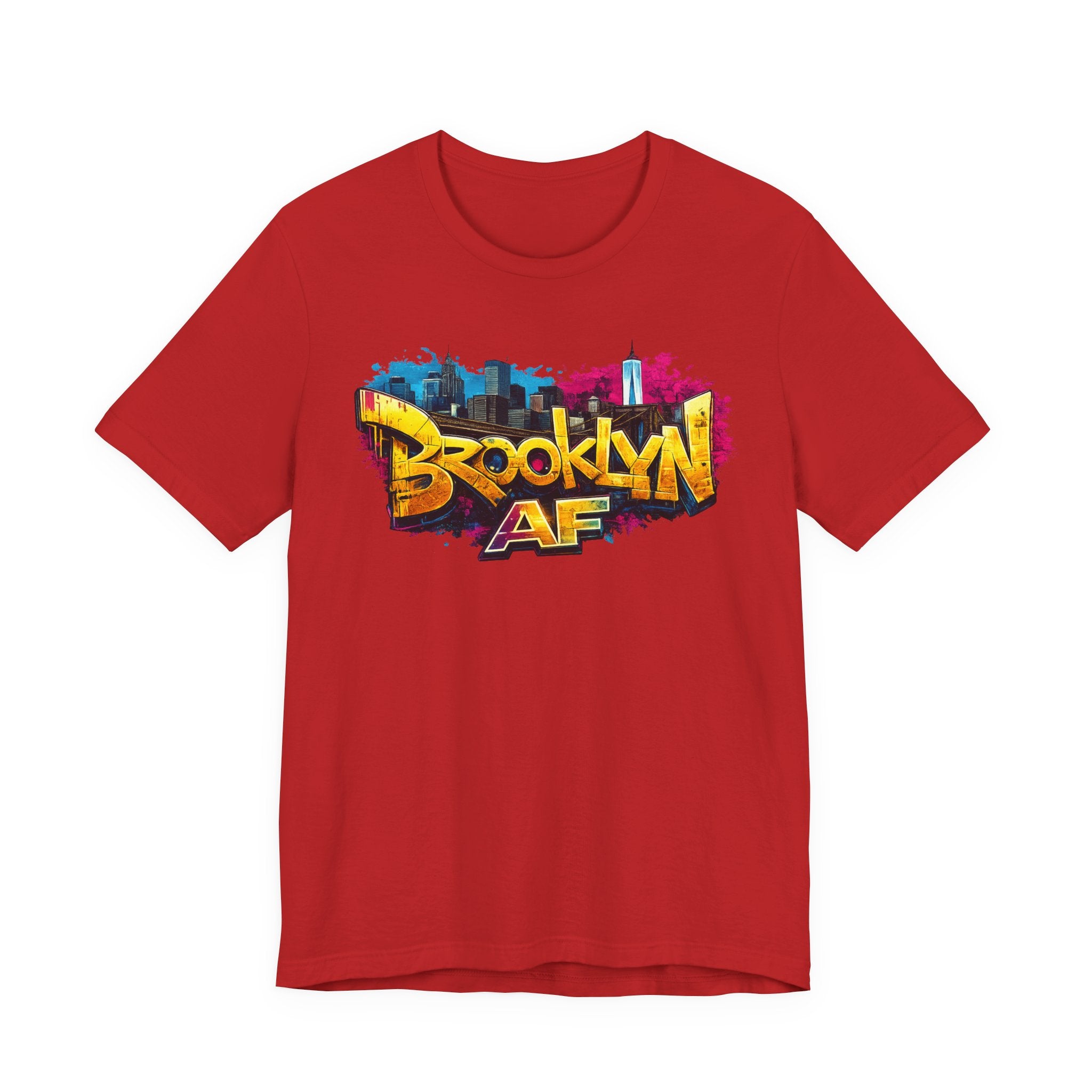 Red t-shirt, front view flat lay, showing colorful graffiti Brooklyn AF lettering over a skyline paint splash.