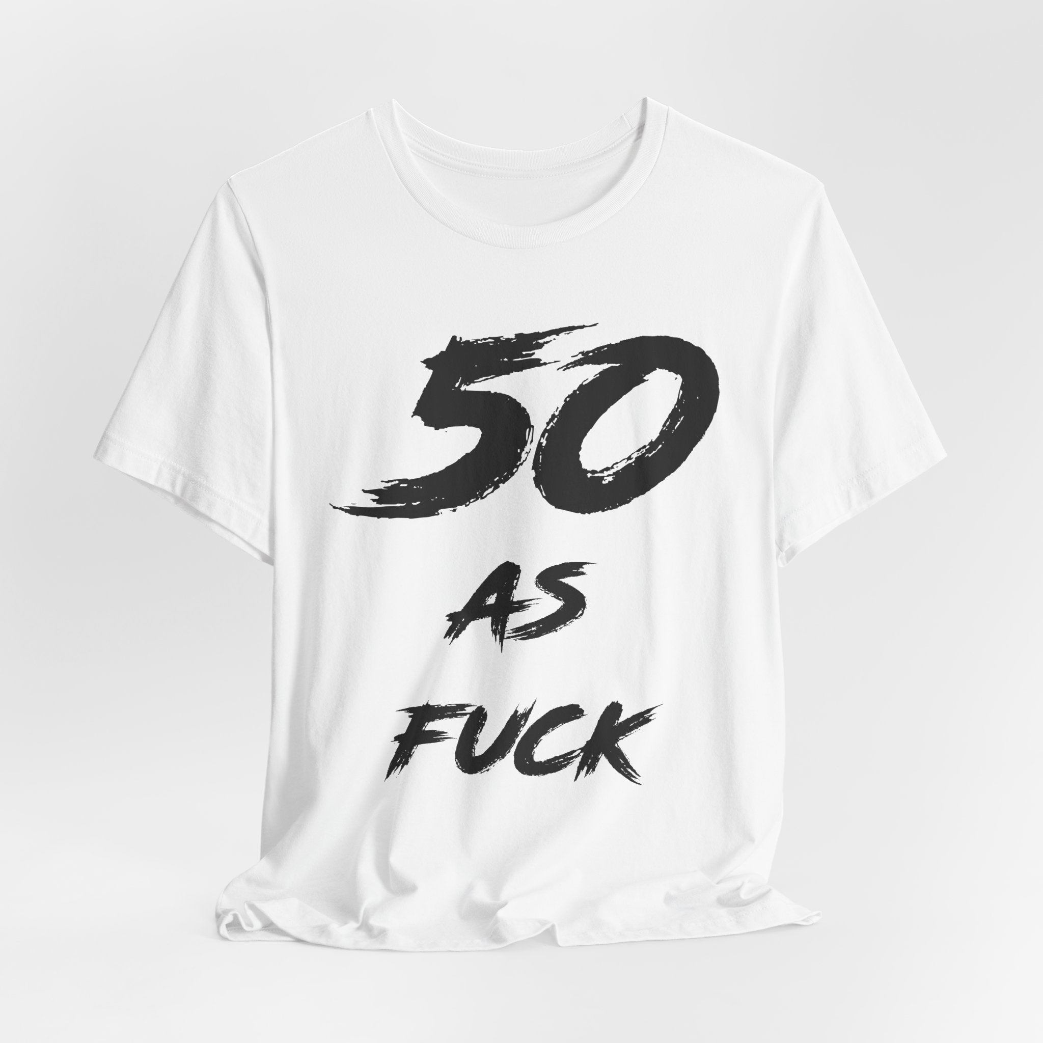 White birthday t-shirt laid flat with the black brush-script 50 AS FUCK print