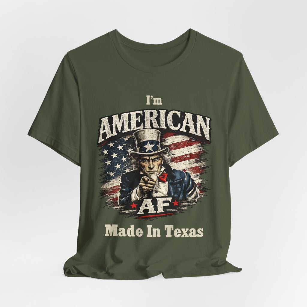 Olive green t-shirt casually draped, showing the Uncle Sam graphic and AF Made In Texas text.