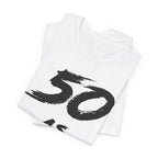 Folded white birthday tees stacked, the black 50 print showing on the top fold