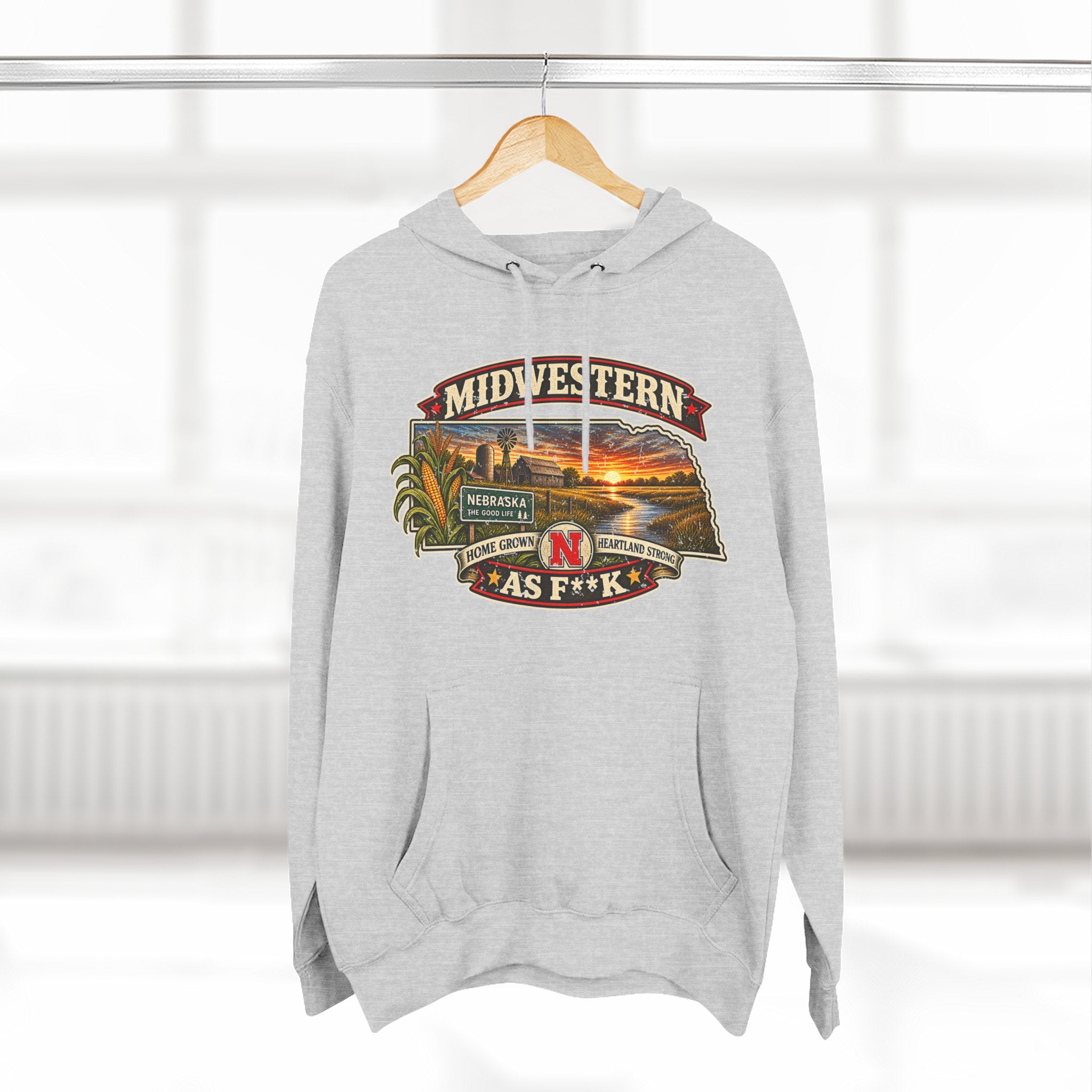 Heather grey Nebraska As F**K hoodie on a hanger with the sunset farm badge