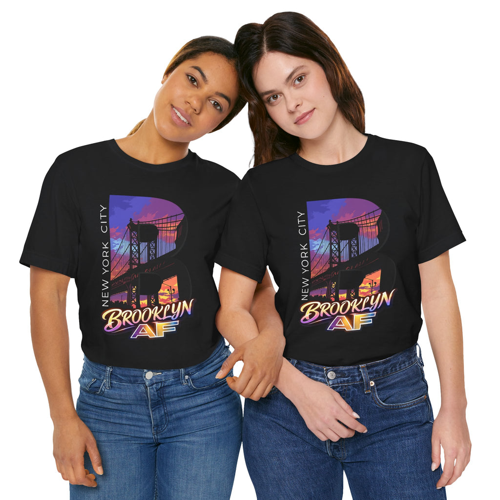 Black t-shirts worn by two models, front view, each with the purple-orange Brooklyn Bridge sunset B graphic.