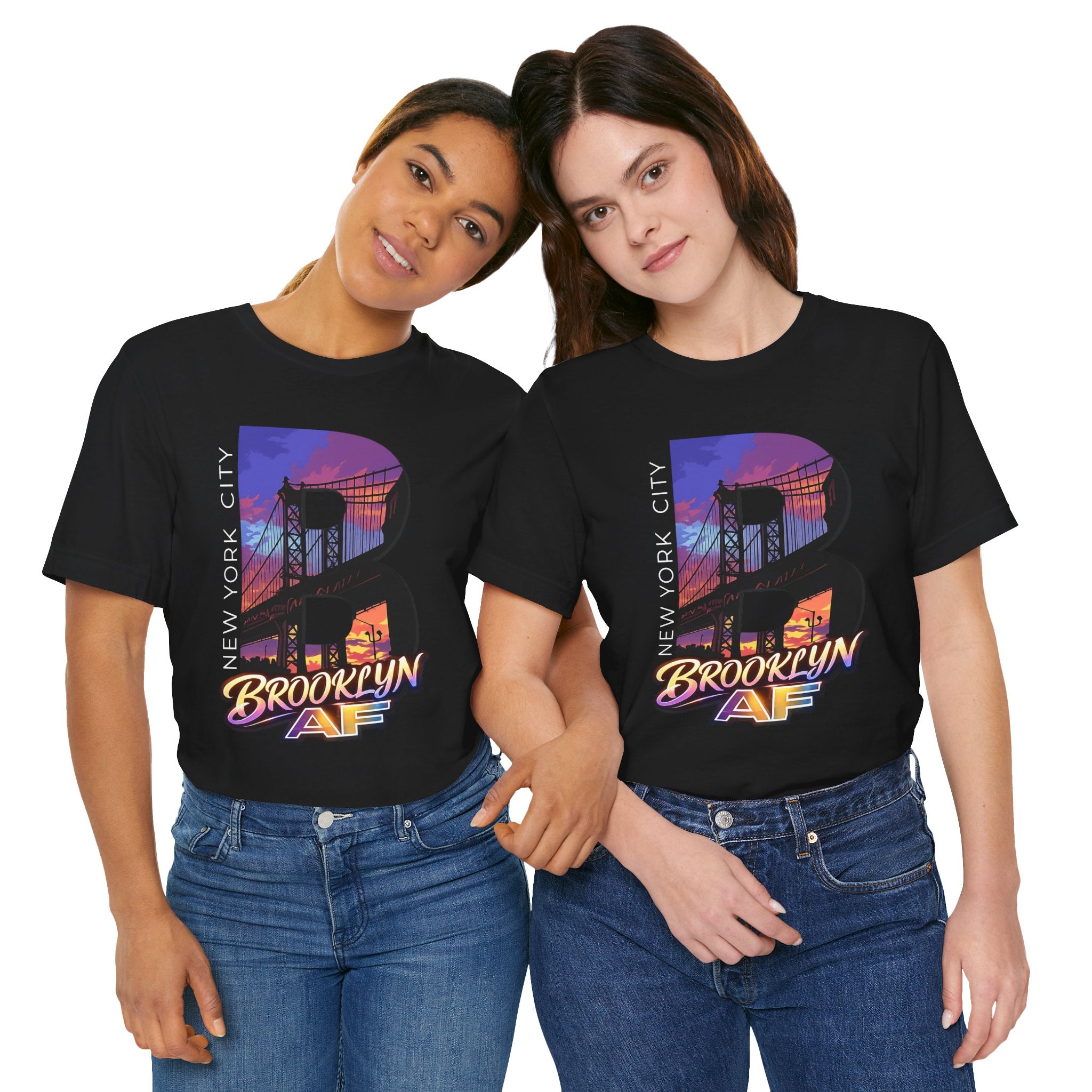 Black t-shirts worn by two models, front view, each with the purple-orange Brooklyn Bridge sunset B graphic.