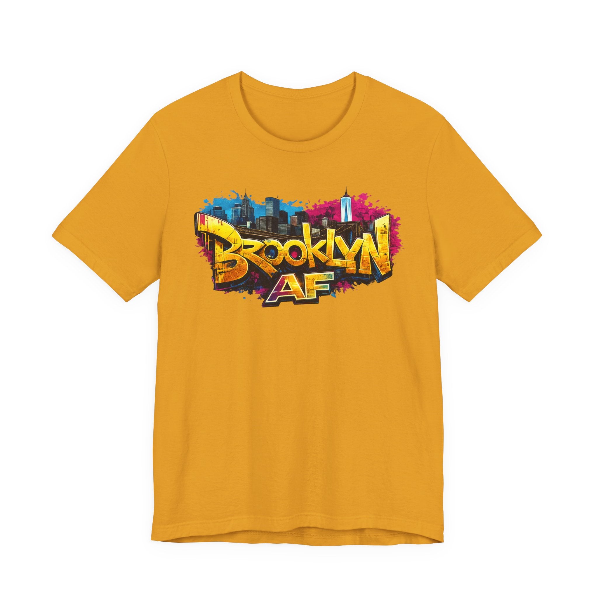 Mustard yellow t-shirt, front view flat lay, featuring graffiti Brooklyn AF lettering over a skyline paint splash.
