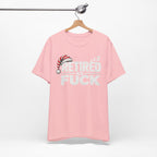 Pink Retired As Fuck T-shirt on a wooden hanger, front retirement print visible
