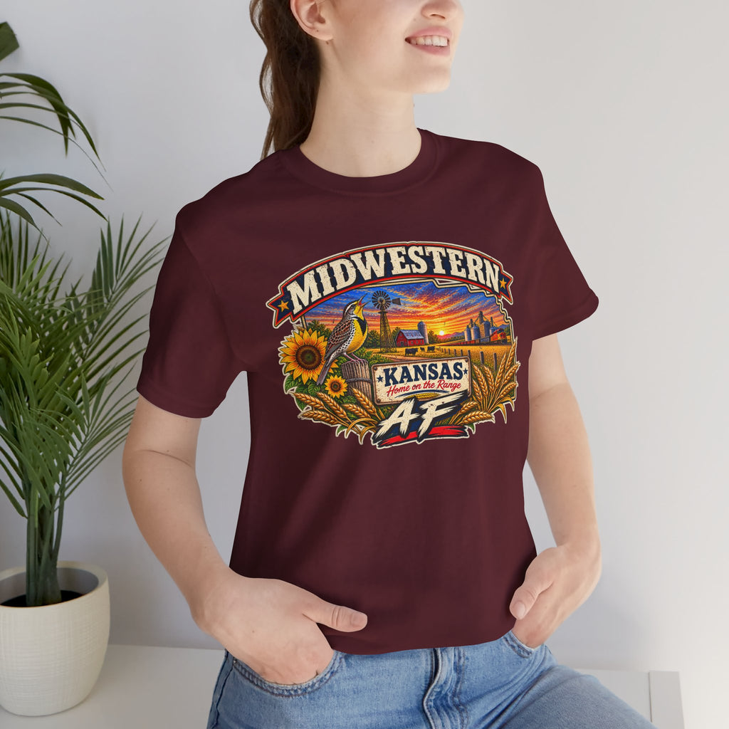 Woman wearing the maroon Kansas AF tee indoors, front graphic in close view