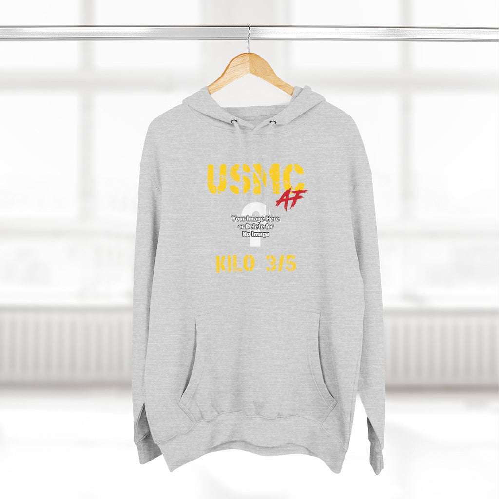 Woman wearing the Personalized USMC Marine Corps AF hoodie in Heather Grey beside a sunlit window