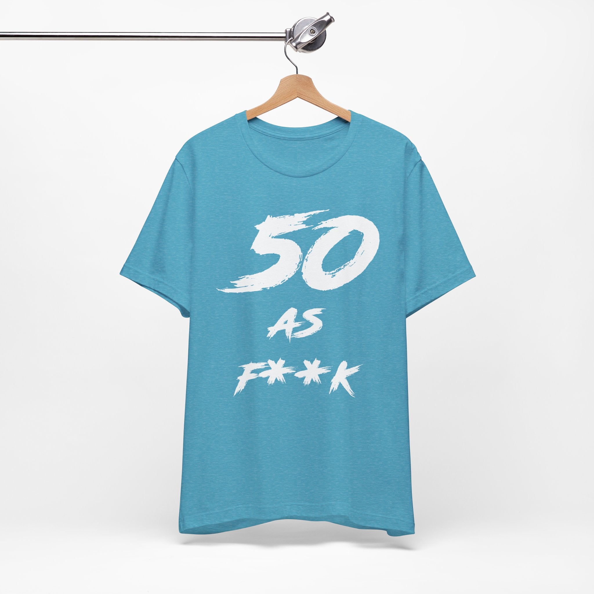 Heather Aqua birthday tee hanging on a hanger, white 50 AS F**K graphic facing front