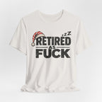 Vintage White Retired As Fuck tee draped, dark lettering on off-white fabric