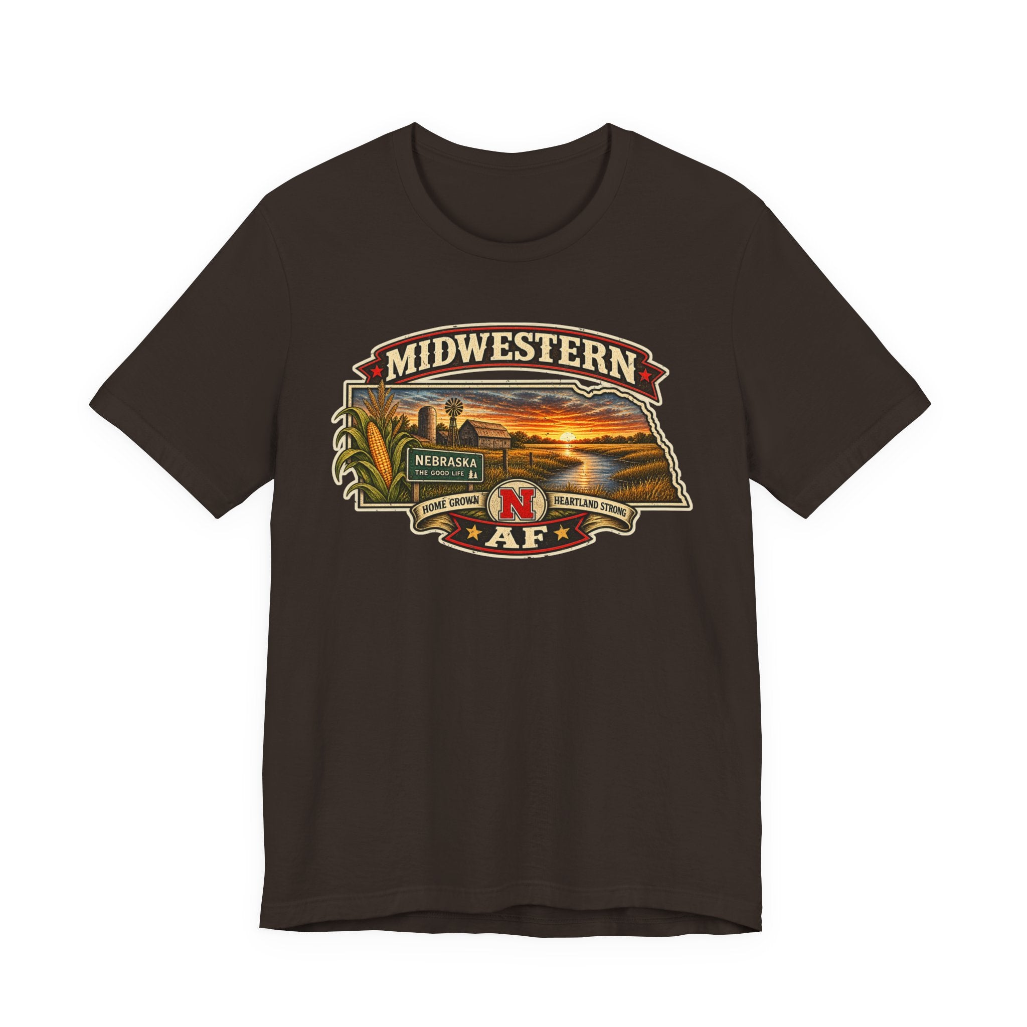 Brown Nebraska T-shirt laid flat, corn stalks and a red barn filling the Nebraska state outline