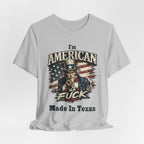 Light gray flat lay tee with Uncle Sam graphic and "I'm American As Fuck, Made In Texas" text