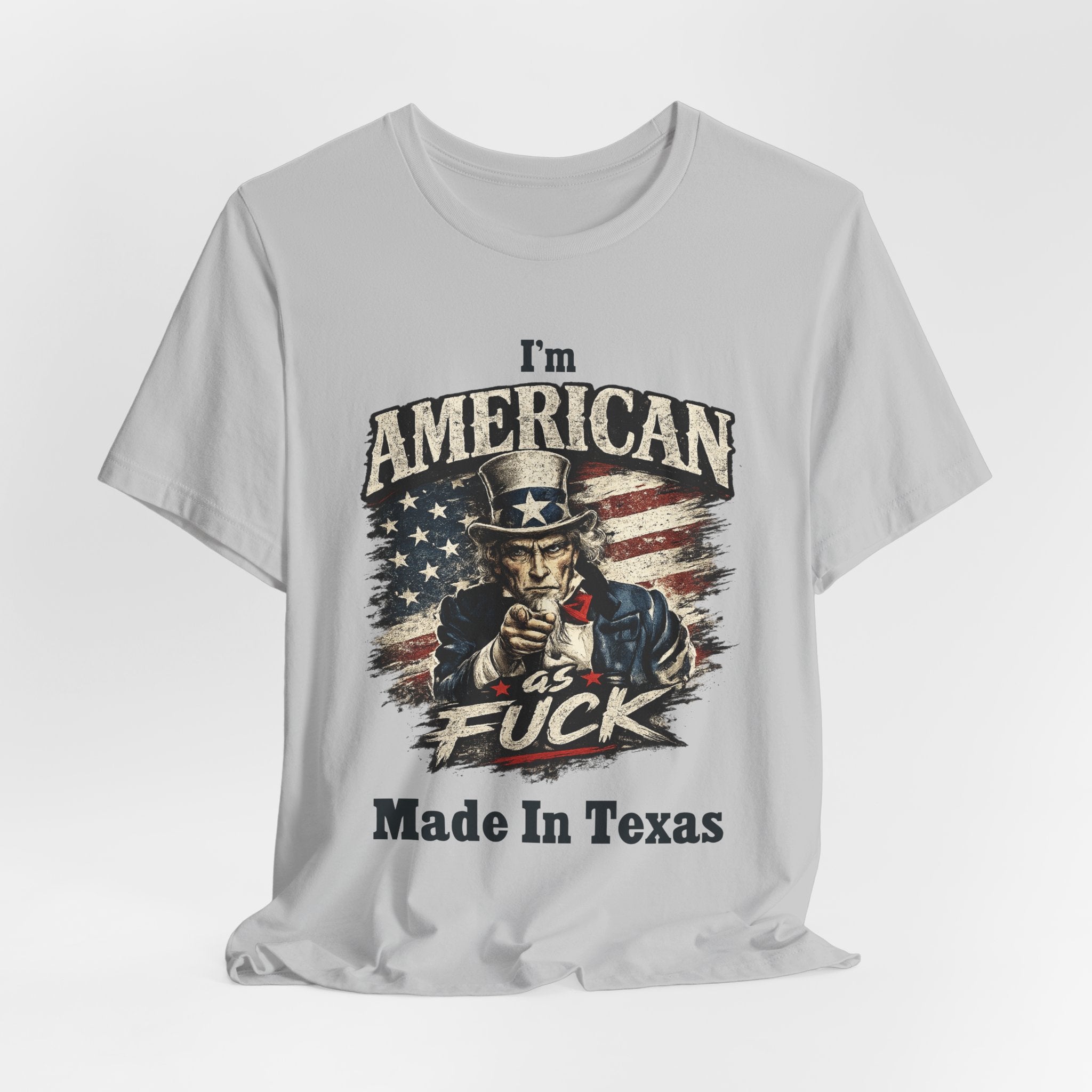 Light gray flat lay tee with Uncle Sam graphic and "I'm American As Fuck, Made In Texas" text