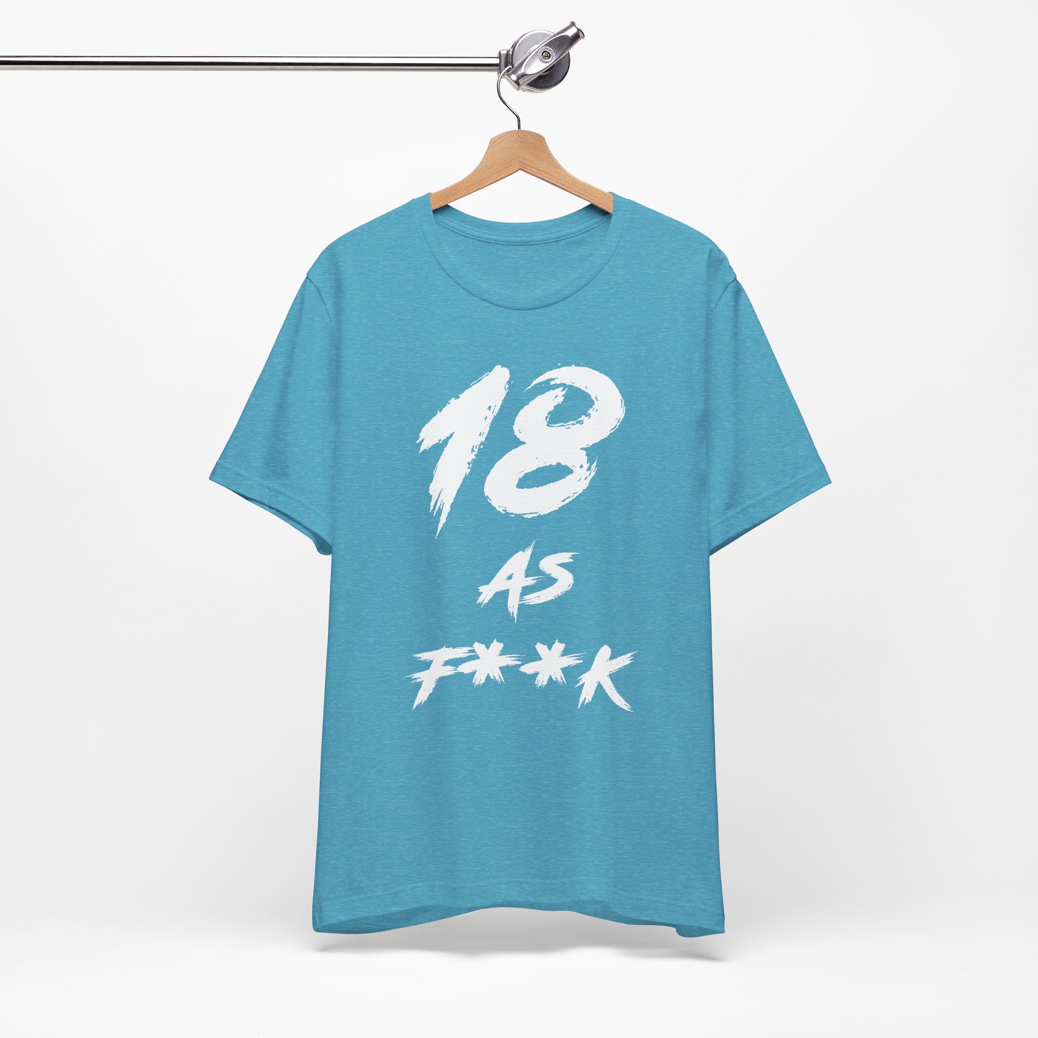 Heather Aqua birthday tee hanging on a hanger, white 18 AS F**K graphic facing front