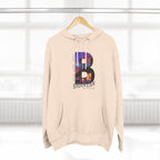 Oatmeal heather hoodie on a wooden hanger, front view, featuring the 'B' Brooklyn skyline graphic and 'As Fuck' text.