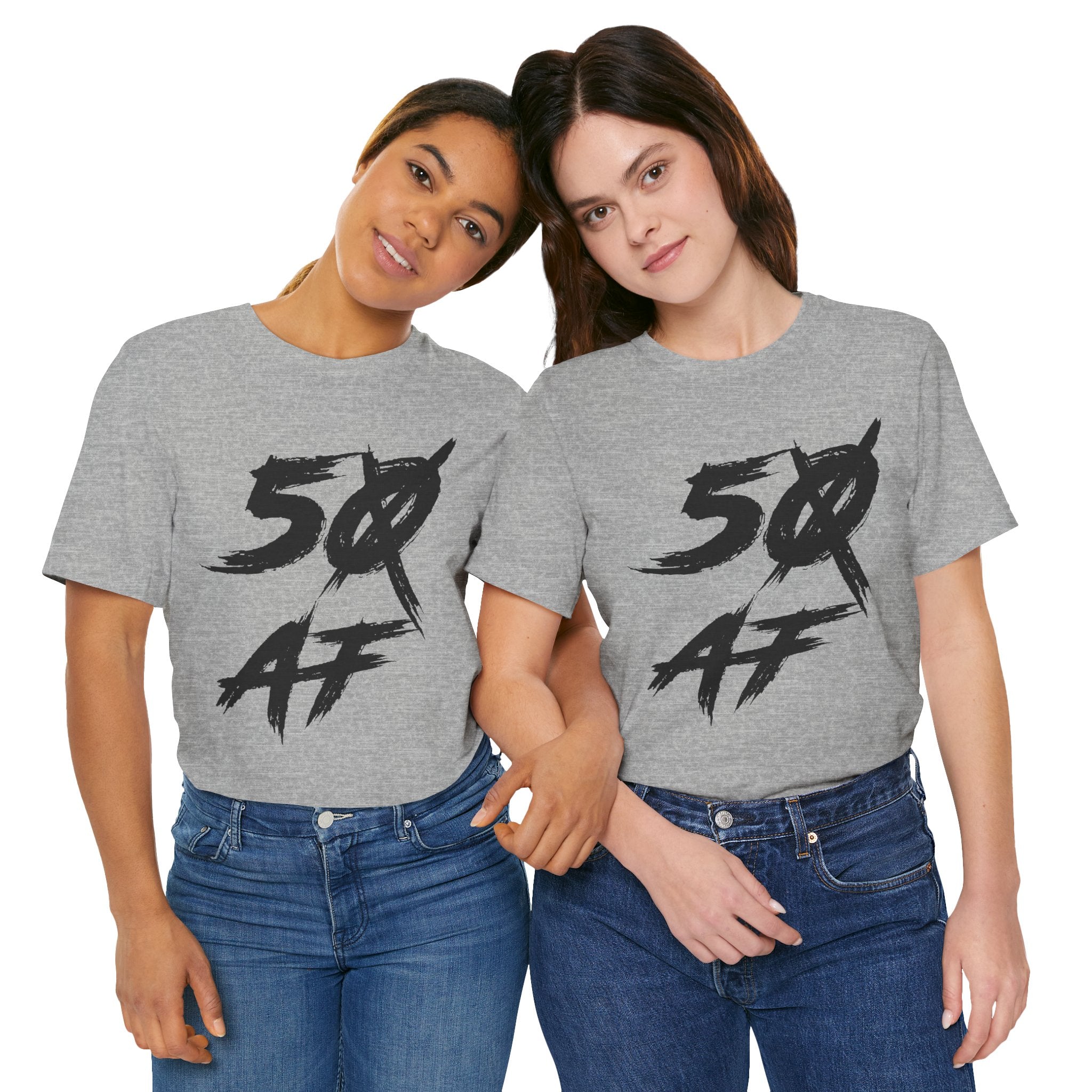 Two women side by side in Athletic Heather tees showing the slashed-zero 50 AF print