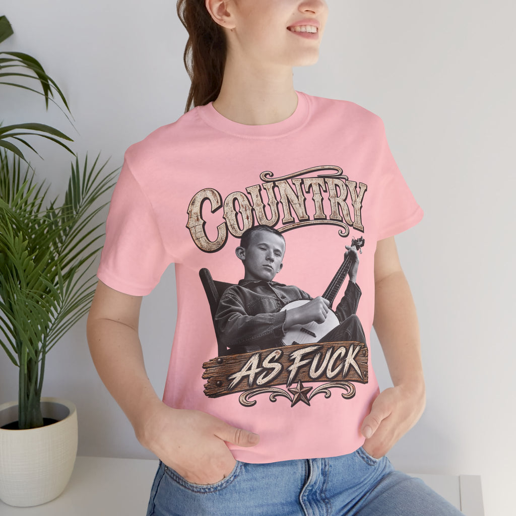 Woman beside a houseplant in the Pink Country As Fuck tee