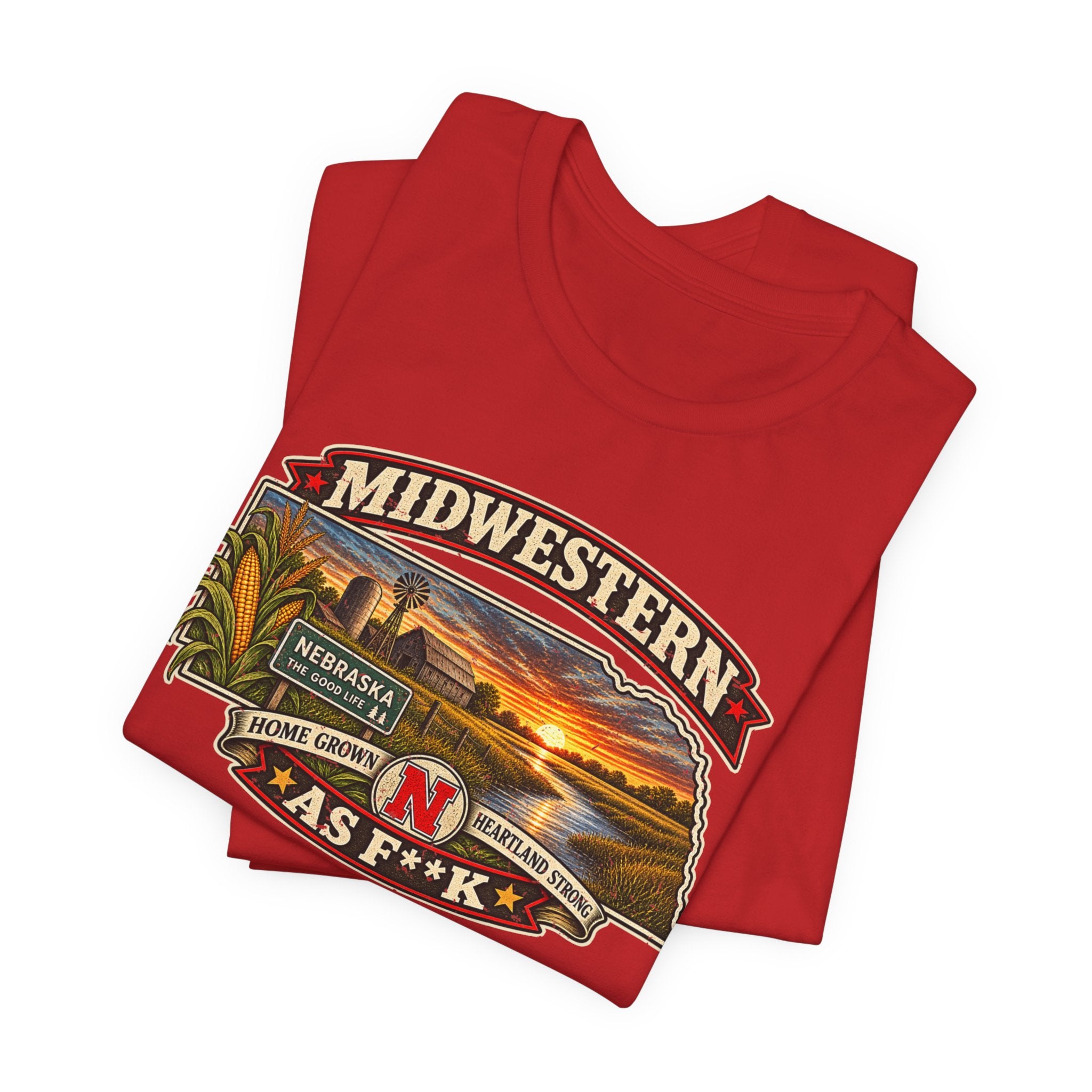 Folded red Nebraska As F**K tee, close on the corn, barn and sunset detail
