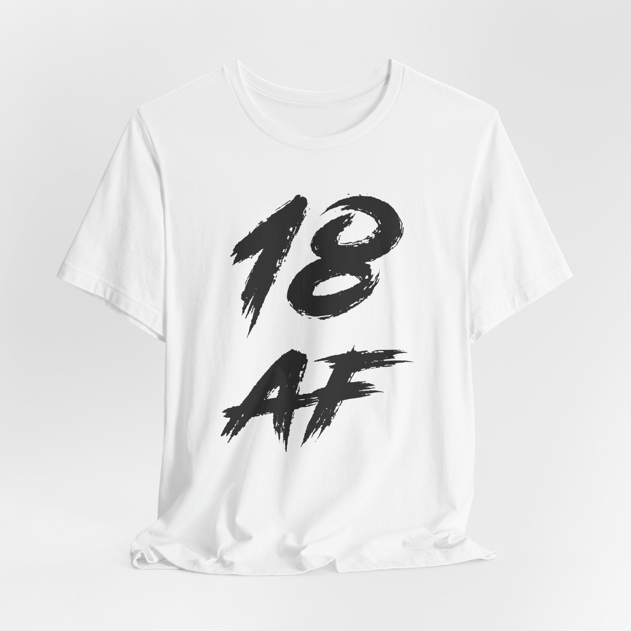 White birthday t-shirt laid flat and rumpled with the black 18 AF print