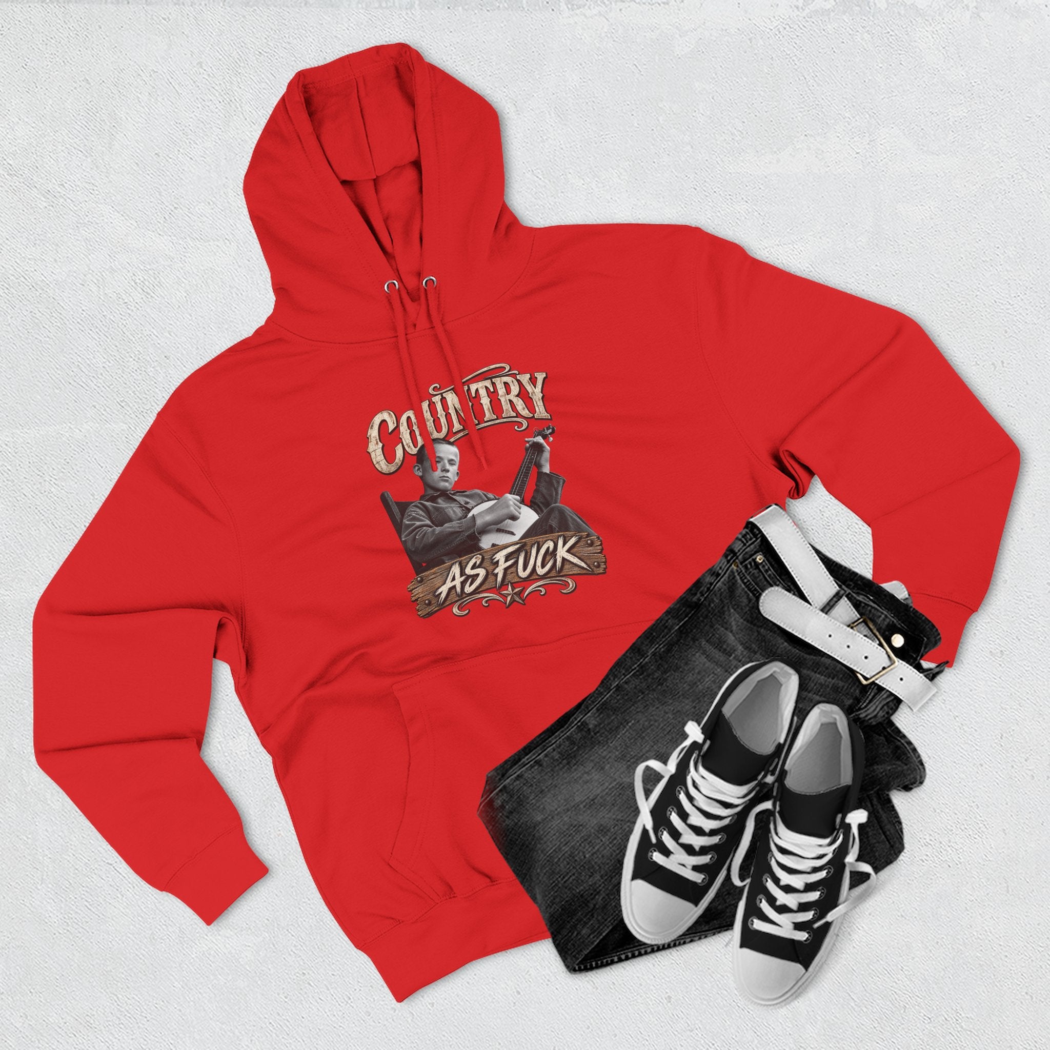 Red Country As Fuck hoodie styled flat with black and white sneakers