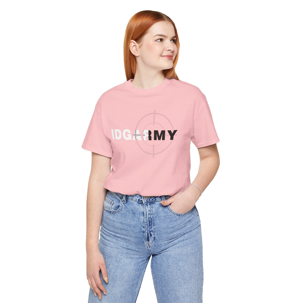 Woman in a pink IDGAF Army tee and jeans, hand in pocket, front print visible