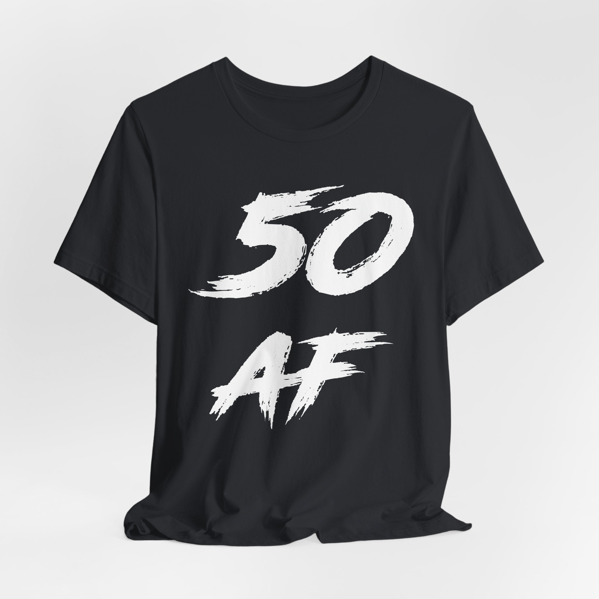 Vintage Black birthday t-shirt laid flat and rumpled, white 50 AF chest graphic