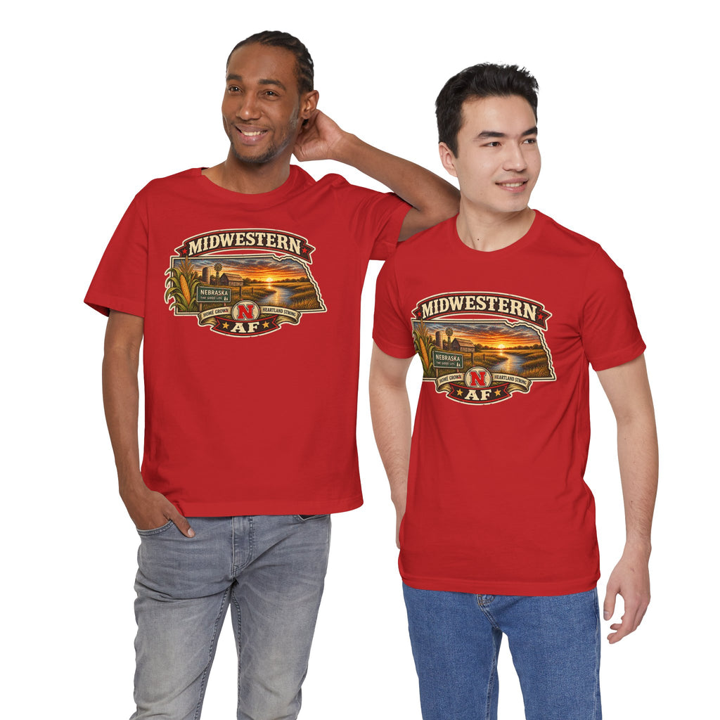Two men in red Nebraska tees, front print showing The Good Life sign and a prairie sunset