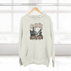 Oatmeal Heather Country As Fuck hoodie on a wooden hanger by a window