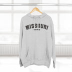 Heather grey personalized Missouri hoodie on a hanger, varsity MISSOURI above a KCMO PROUD line