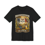 Midwestern As Fuck Iowa T-Shirt in Black – a distressed vintage design featuring the outline of Iowa overlaid with the Iowa state flag, surrounded by towering corn stalks, rolling farmland, a classic red barn, a windmill, a tractor, and an overflowing harvest basket