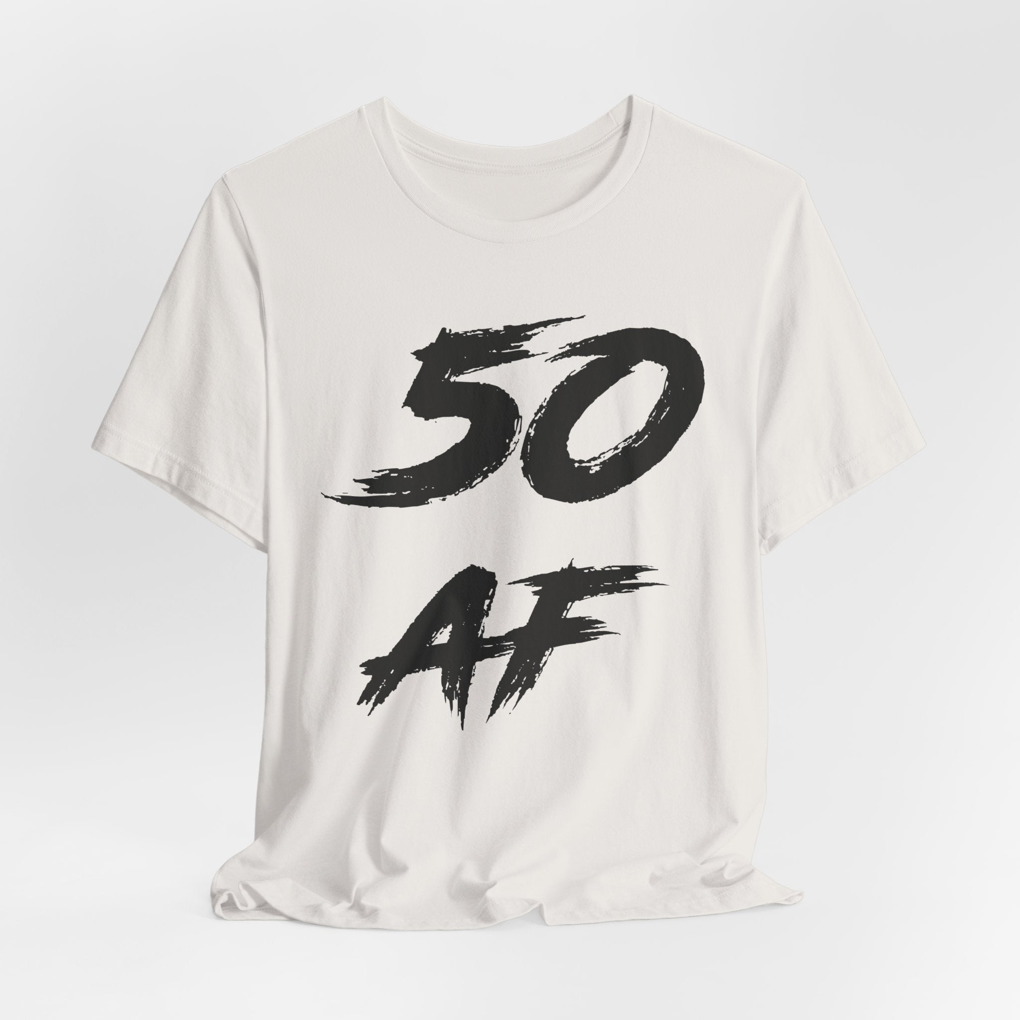 Vintage White birthday t-shirt laid flat with the black 50 AF brush lettering