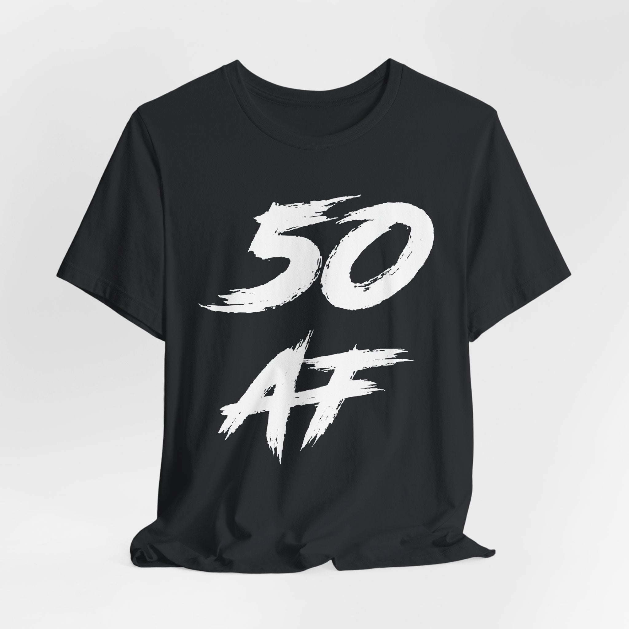 Vintage Black birthday t-shirt laid flat, white 50 AF brush graphic on the chest
