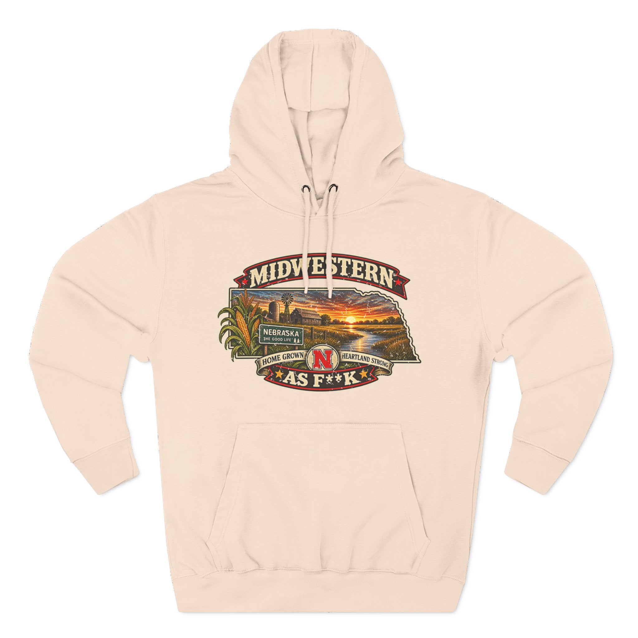 Pale pink Nebraska As F**K hoodie laid flat, corn stalks framing the prairie sunset