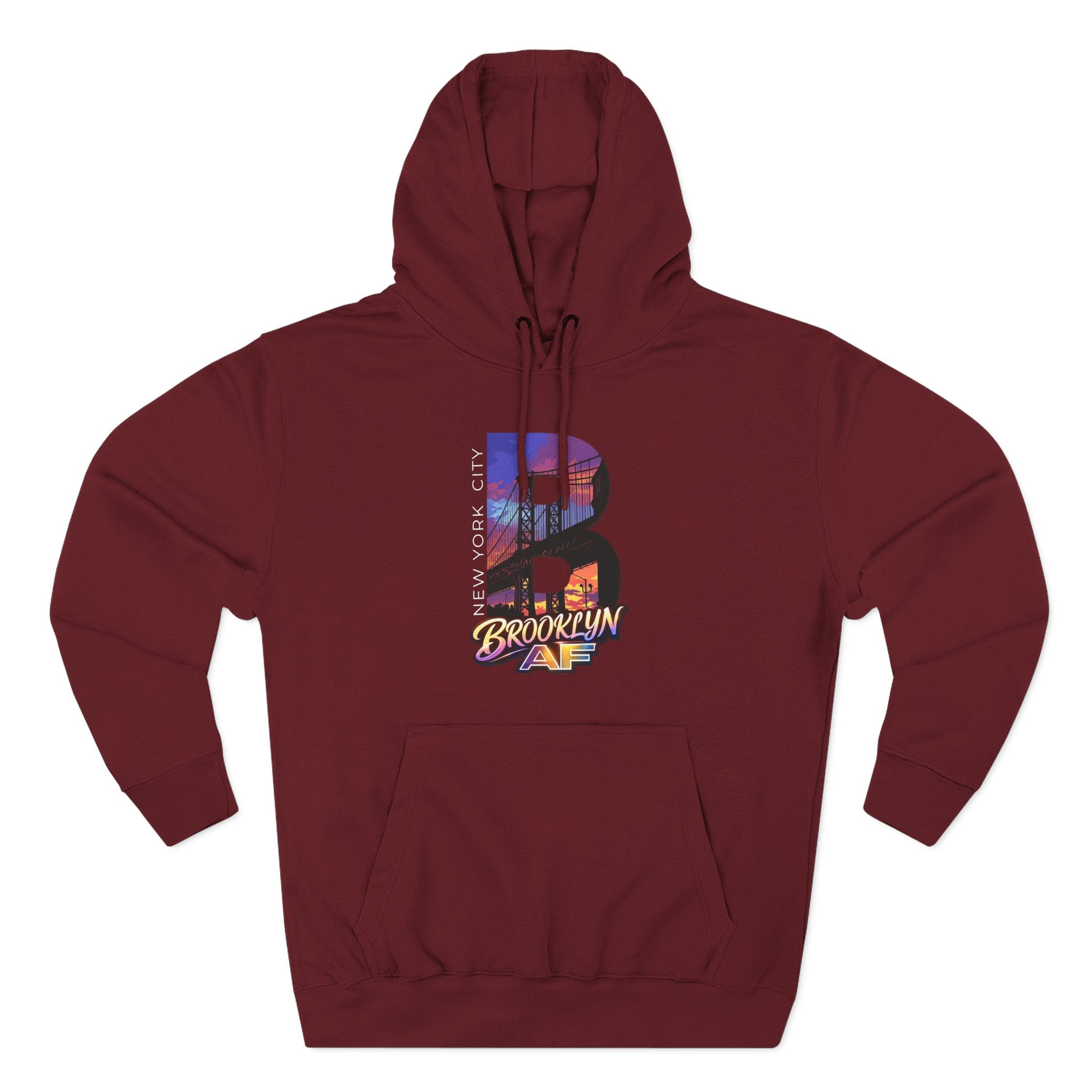 Red hoodie, front-facing flat lay, showing the oversized "B" with a Brooklyn Bridge sunset skyline graphic on the chest.