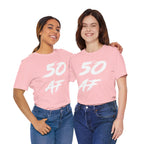 Two women together in matching pink 50 AF birthday tees