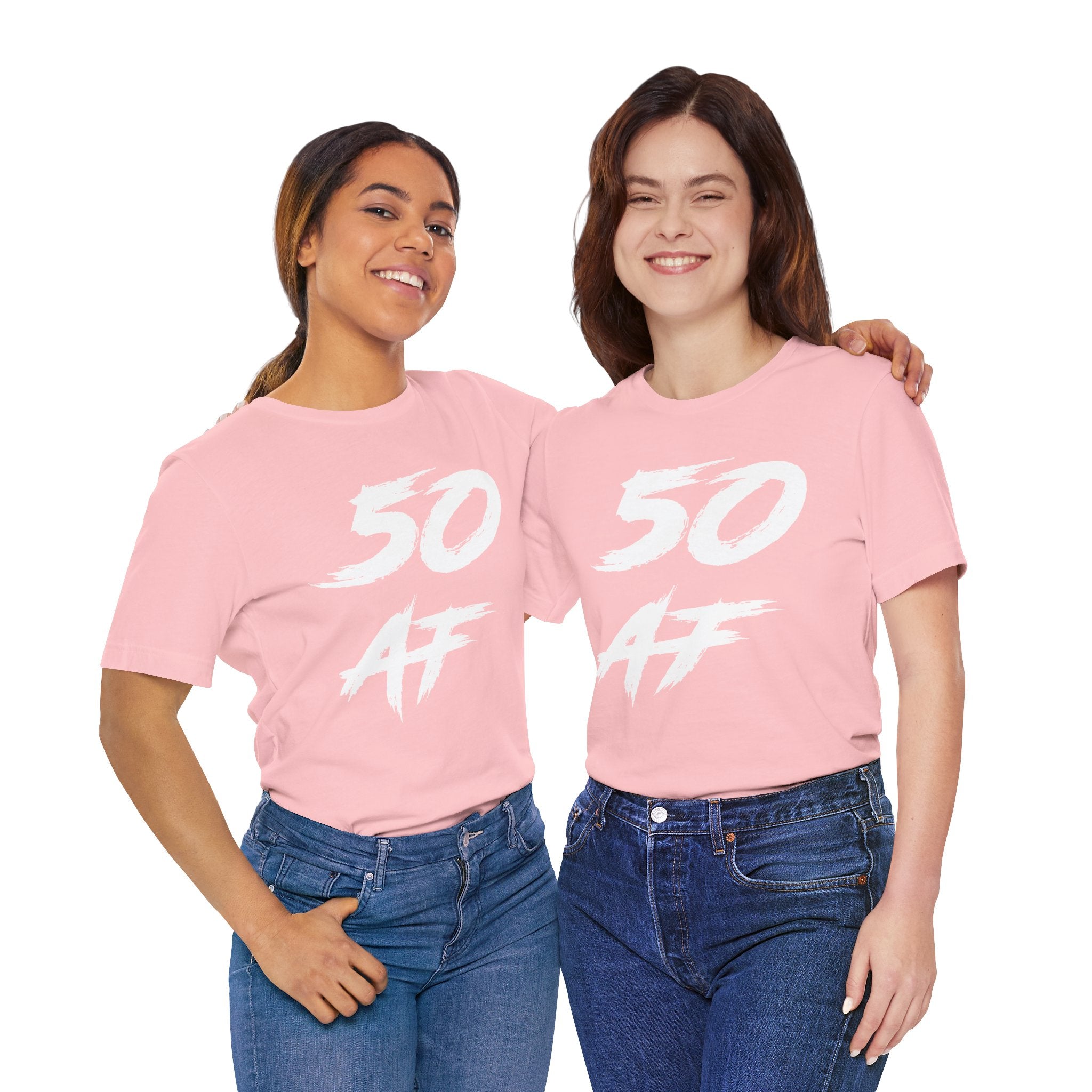 Two women together in matching pink 50 AF birthday tees