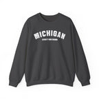 Dark heather custom Michigan crewneck laid flat, white varsity MICHIGAN over a custom text line