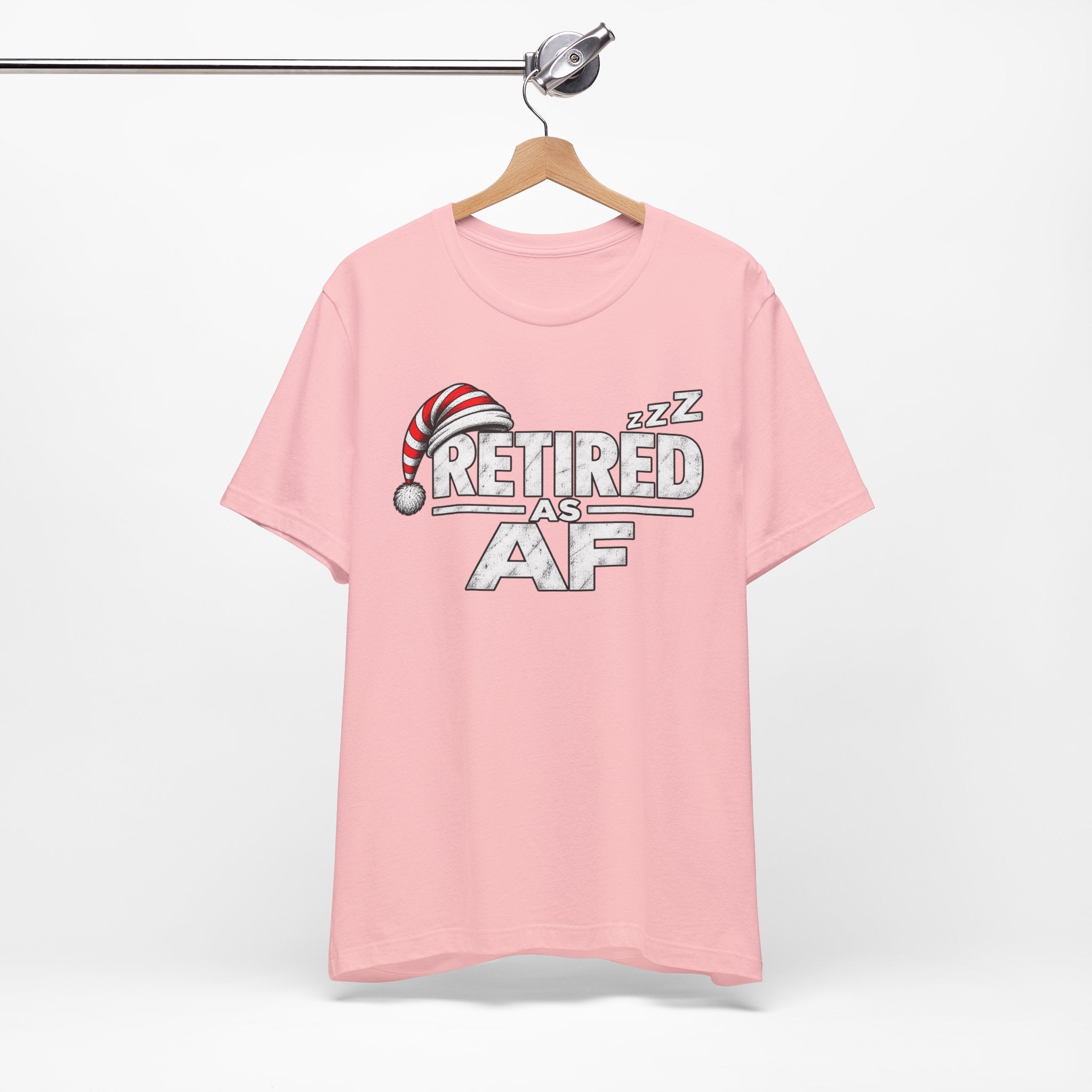 Pink Retired AF T-shirt on a wooden hanger, front print with the nightcap and ZZZs