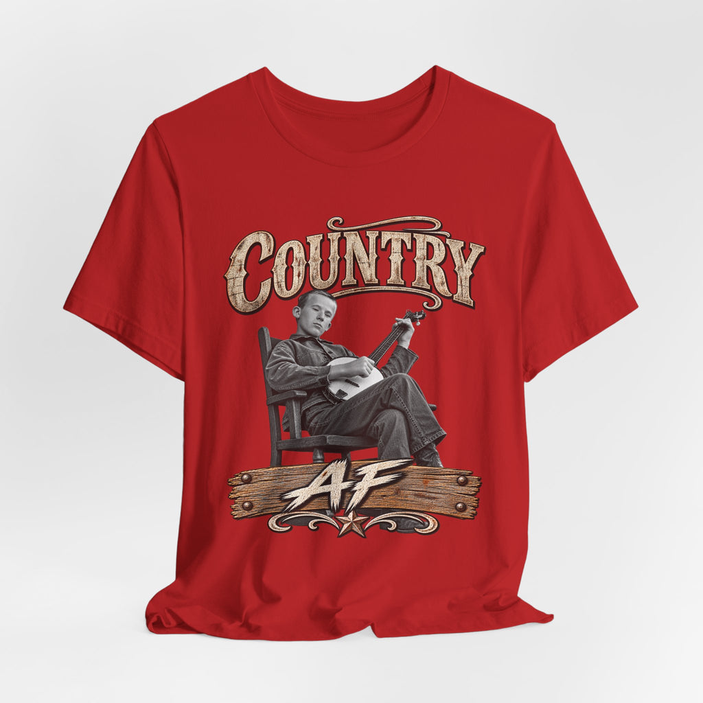 Red Country AF tee draped loosely, rocking-chair banjo graphic showing