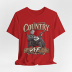 Red Country AF tee draped loosely, rocking-chair banjo graphic showing
