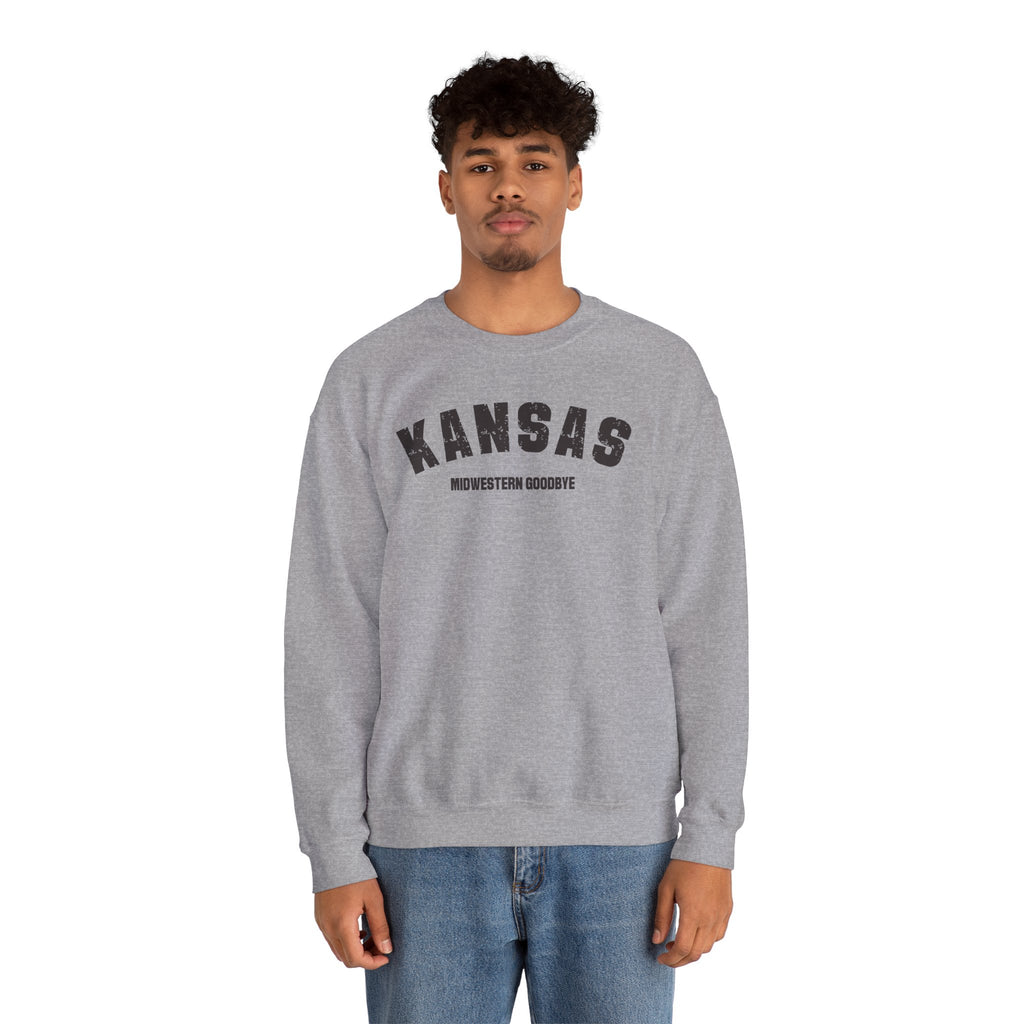 Man wearing the sport grey Kansas sweatshirt, varsity KANSAS above the words MIDWESTERN GOODBYE