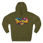 Army Green hoodie, flat lay front view, with graffiti-style Brooklyn AF logo and NYC skyline paint-splash print.