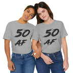 Two women side by side in Athletic Heather 50 AF tees with the black brush lettering
