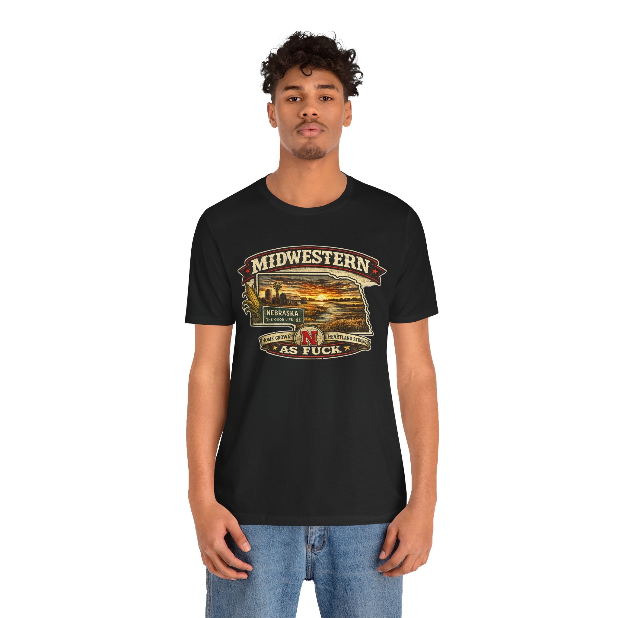 Man wearing the black Nebraska As Fuck tee with the state-shaped farm print
